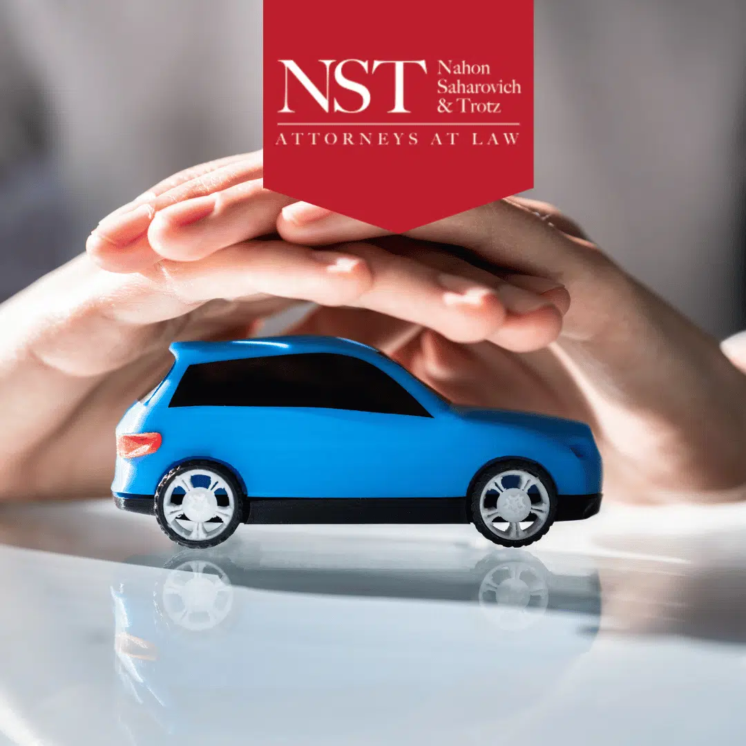 hands over blue toy car