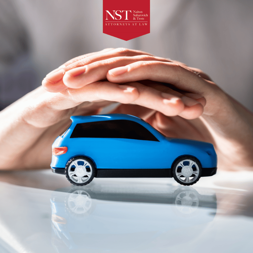 hands over blue toy car