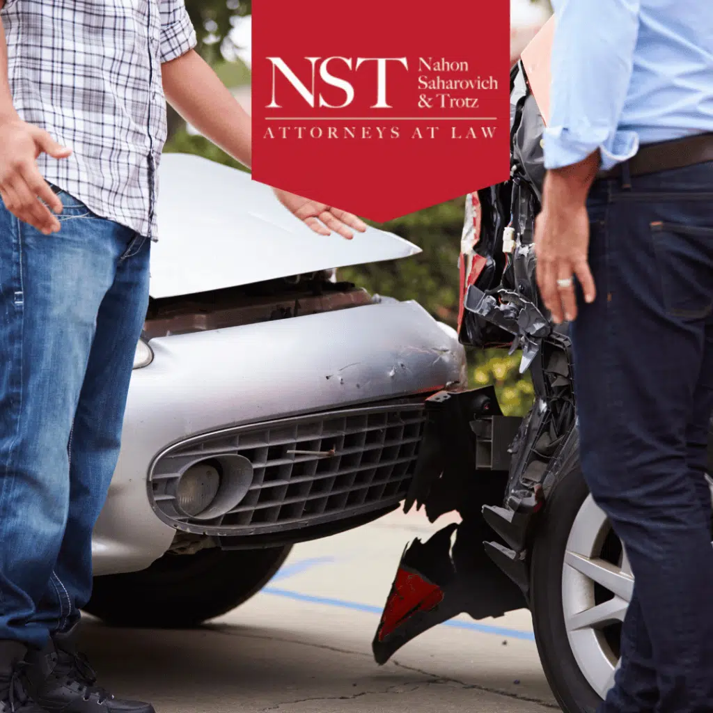 Standing by car after accident