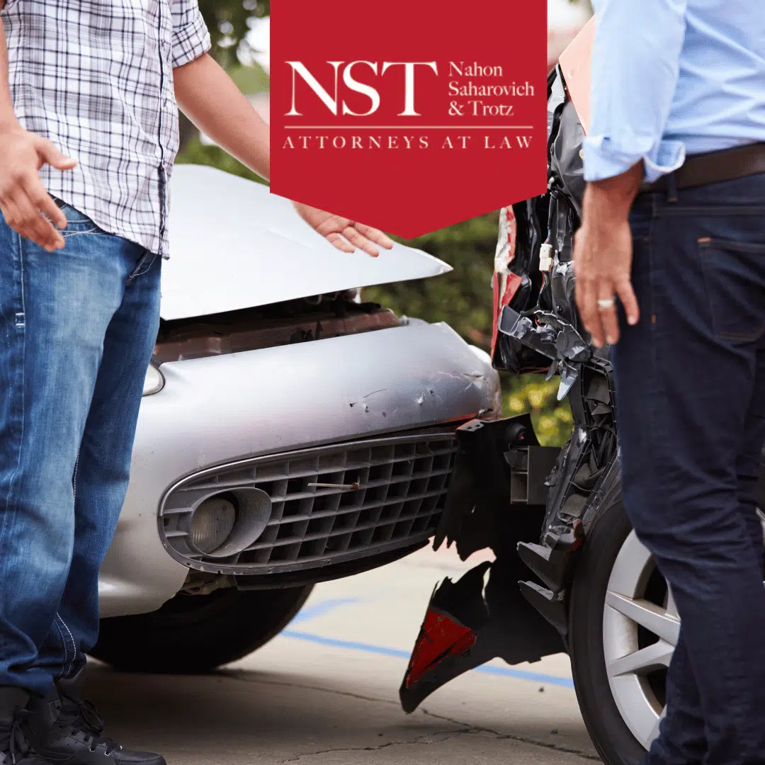 Standing by car after accident