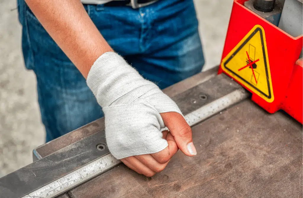 A construction worker with a bandaged hand