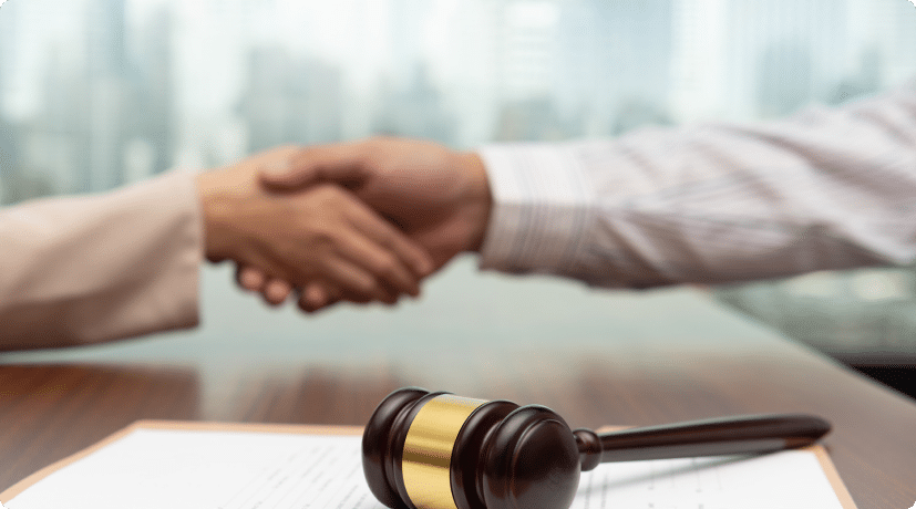 Two lawyers shaking hands