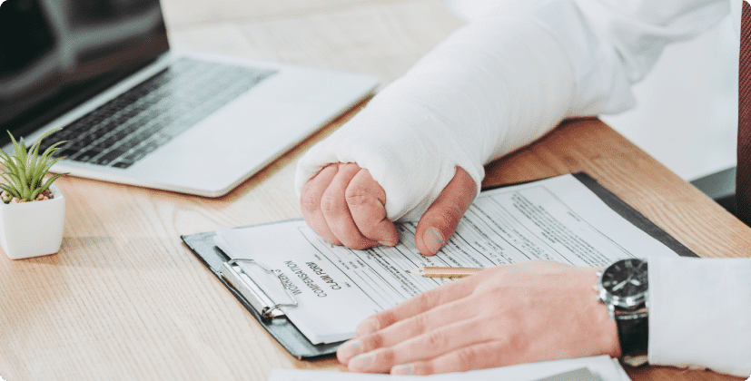 Person with an arm cast going over medical documents