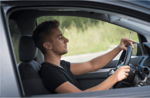 man driving a car