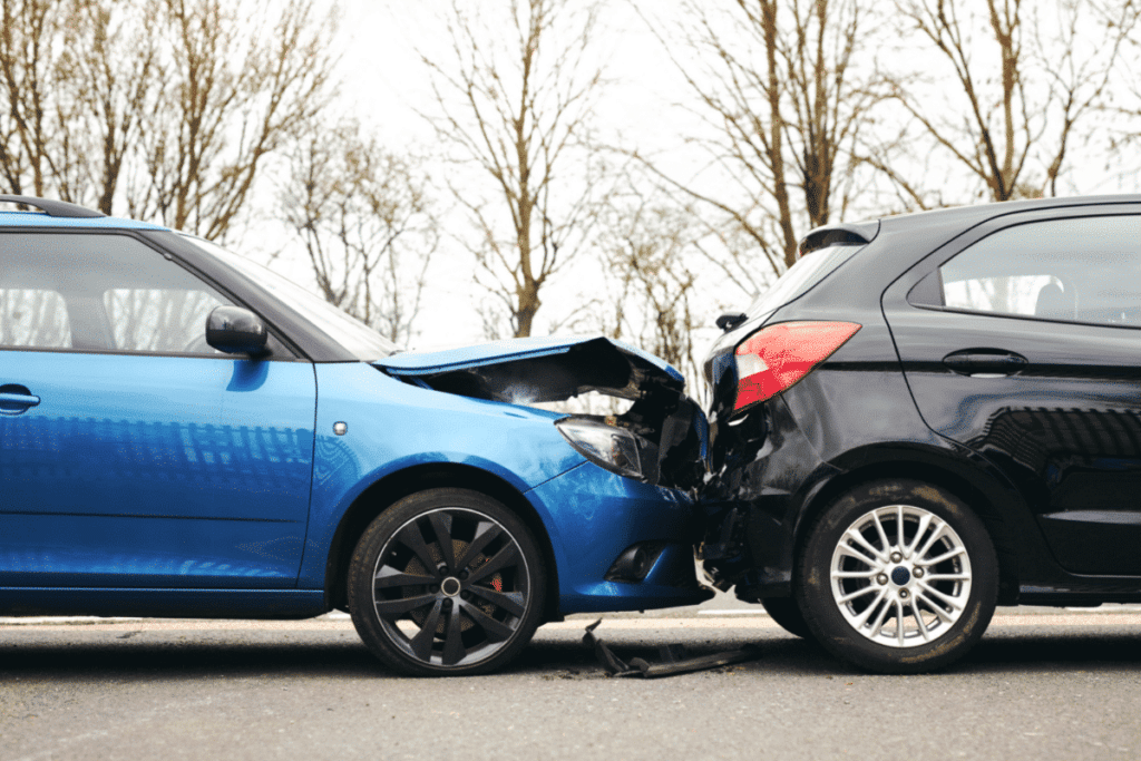 rear end accident blue and black car