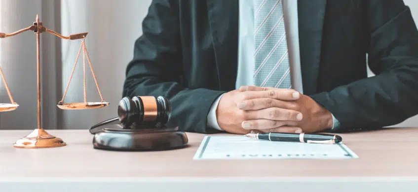 A lawyer sitting in front of a legal document