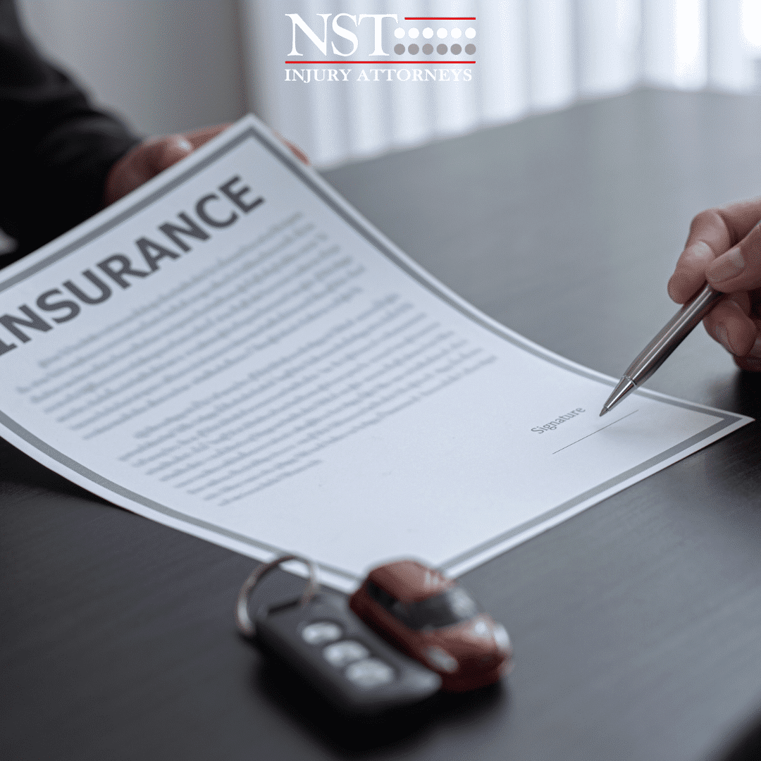 Lawyer reviewing car insurance information with a client