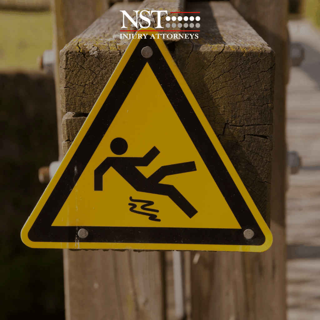 a warning sign showing a person slipping