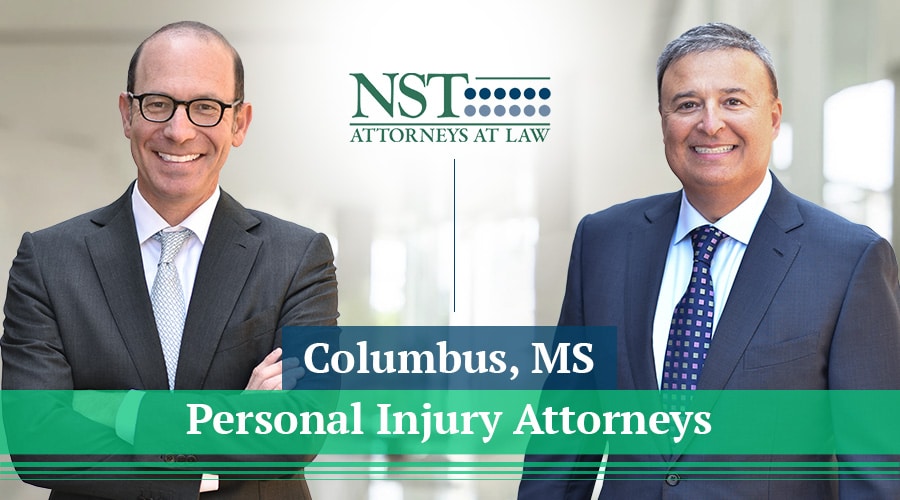 Photo of NST Law attorneys with text reading "Columbus, MS Personal Injury Attorneys"