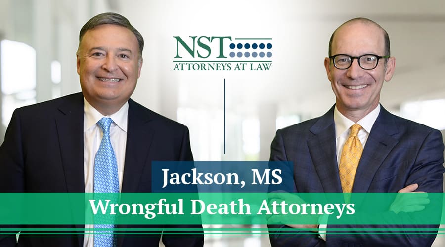 NST Law team photo with banner text "Jackson, MS Wrongful Death Attorneys"