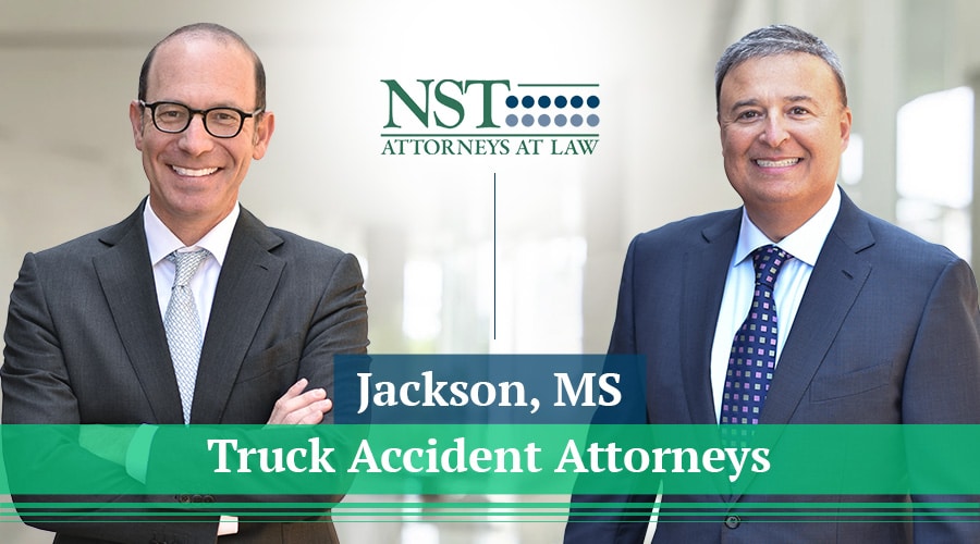 Photo of NST Law attorneys with text reading "Jackson, MS Truck Accident Attorneys"