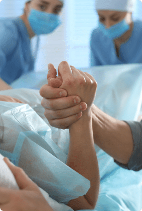 Doctor holding patient's hand in the hospital
