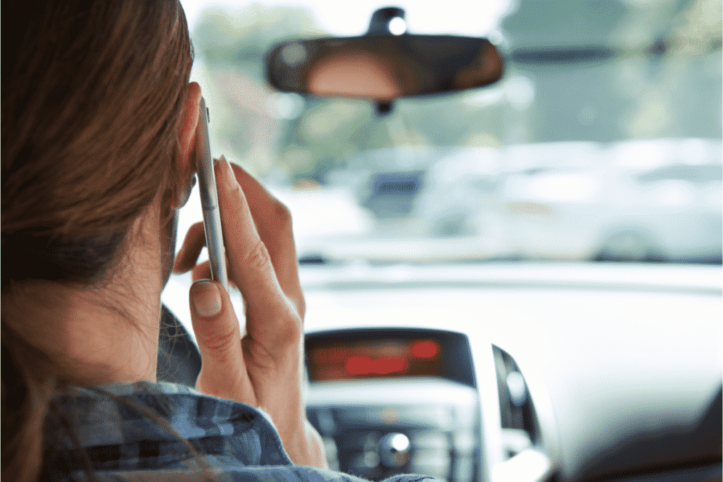 Woman on cell phone while driving before a car accident