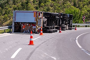 Truck tipped over on road