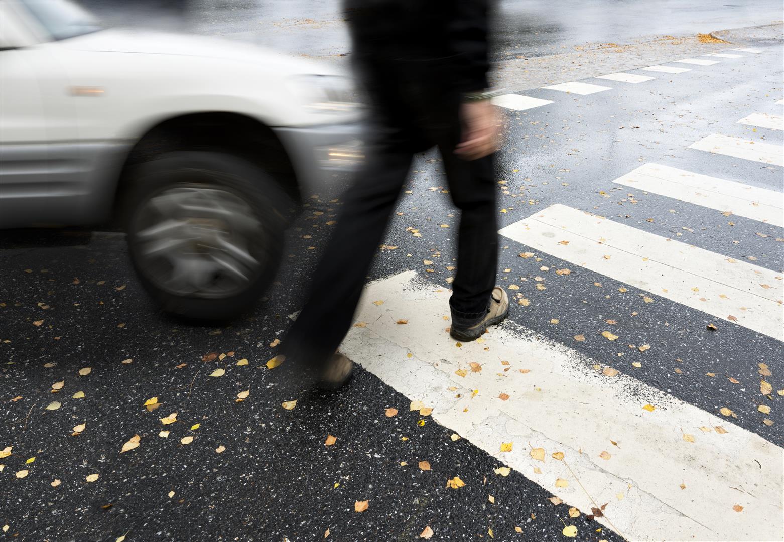 pedestrian about to be hit by car at crosswalk