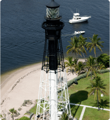 Photo of a light tower beside the water