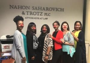 NST Law team wearing red Rudolph noses